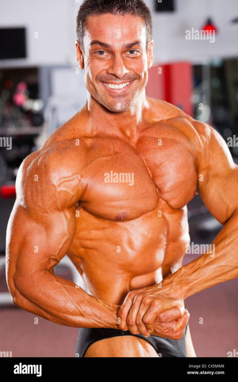 professional male bodybuilder posing in gym Stock Photo - Alamy